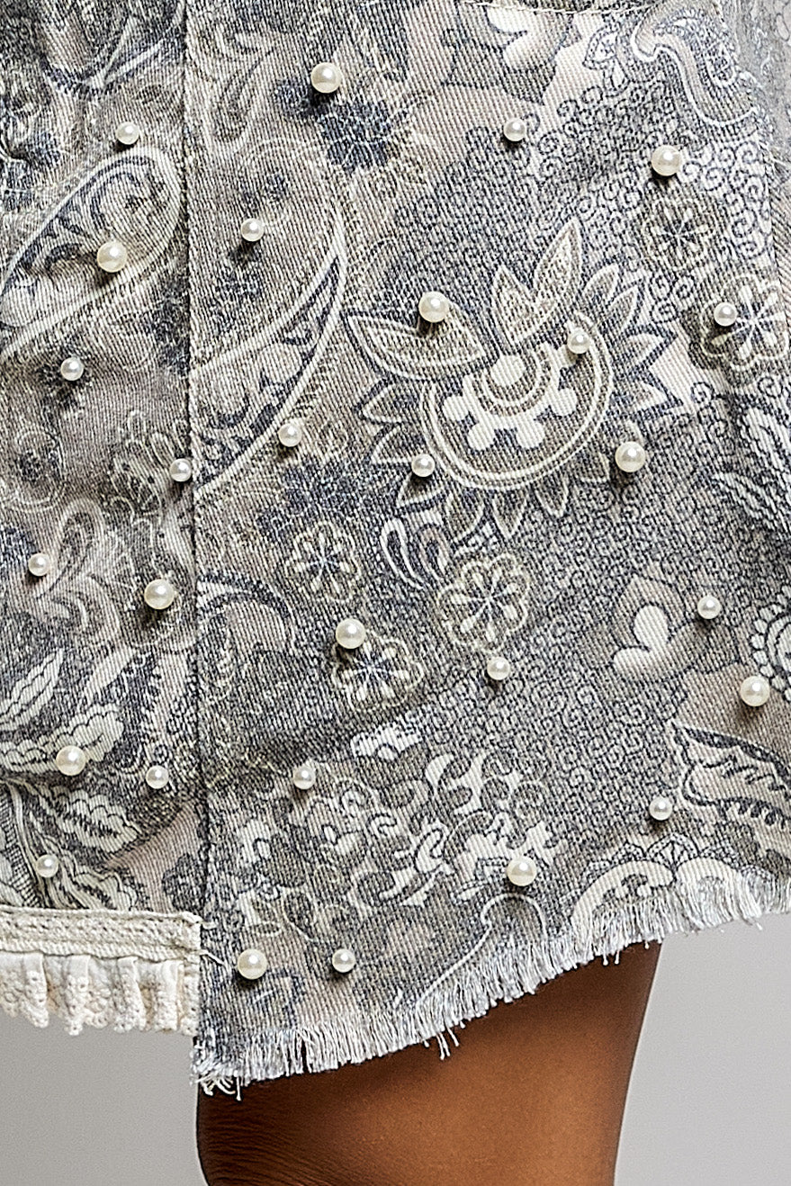 Front angled view of pearl trim paisley twill mini skirt
