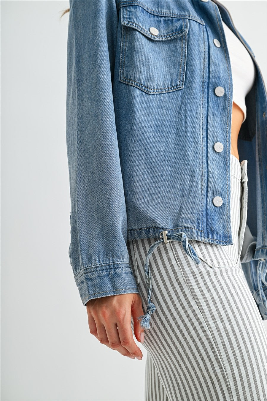 Medium Wash Back Storm Flap Denim Jacket - Front Close-Up of Chest Pocket and Snap Button Detail
